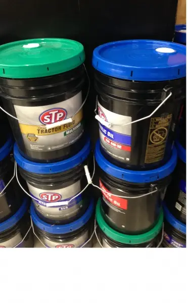 Buckets containing oil.